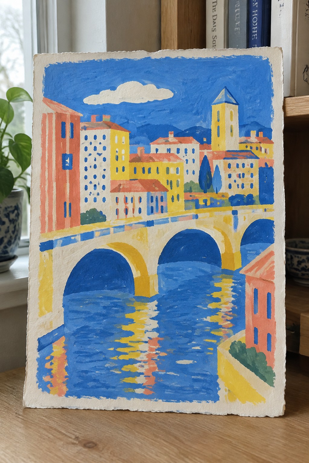 Vivid painting of arched bridge over blue river reflecting colorful buildings and yellow tower