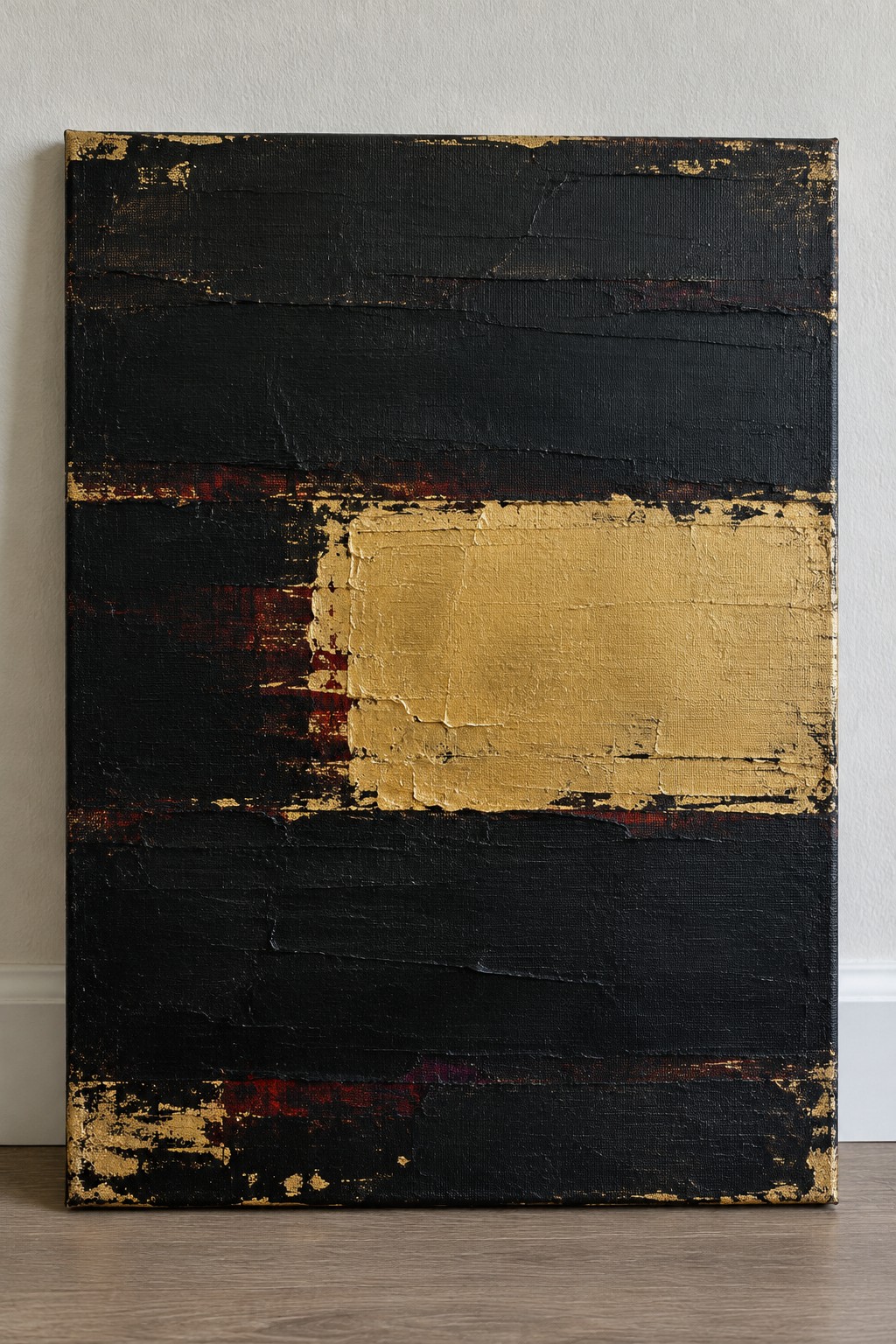 Abstract painting with black layers, gold rectangle, and red accents on canvas