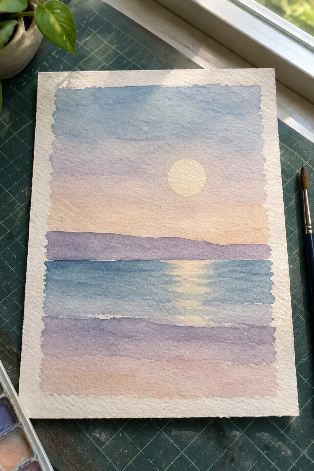 Watercolor sunset with pale sun over gradient sky and layered blue-purple waters