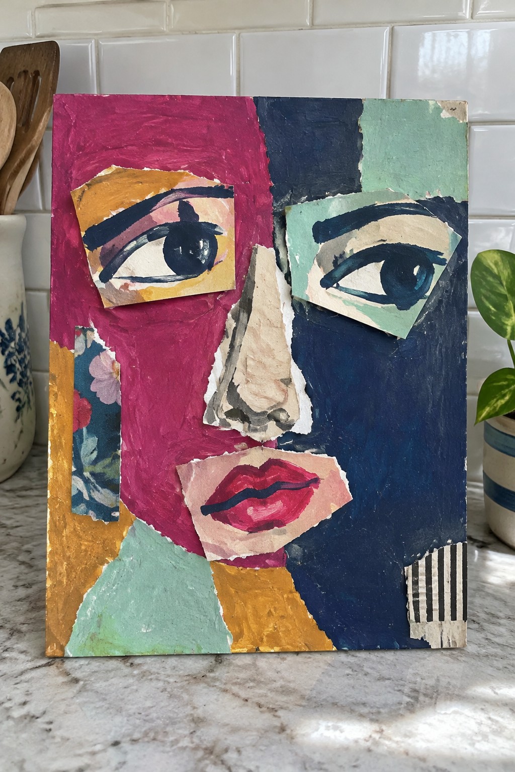 Vibrant abstract collage portrait of a face with bold colors and torn paper textures