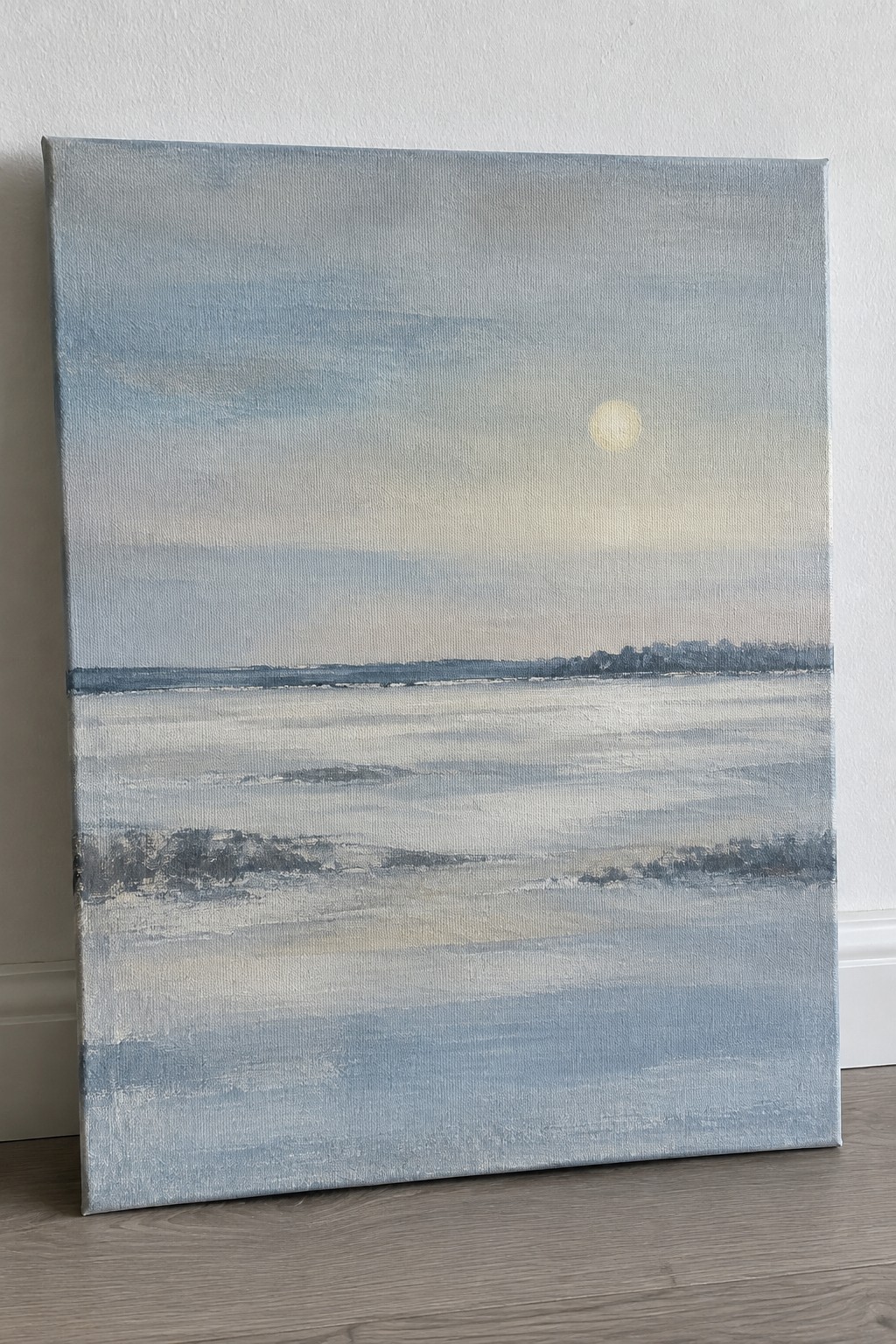 Canvas painting of hazy sun over misty blue waters and distant treeline.