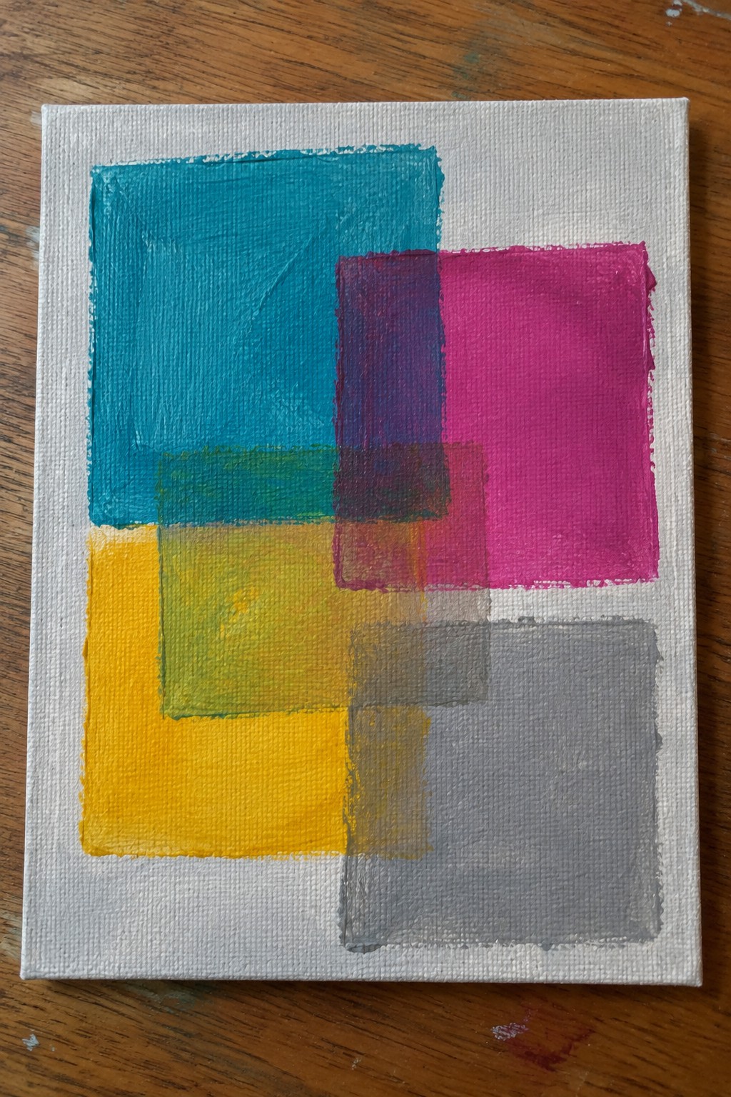 Abstract painting with overlapping translucent squares in teal, pink, yellow, and gray.