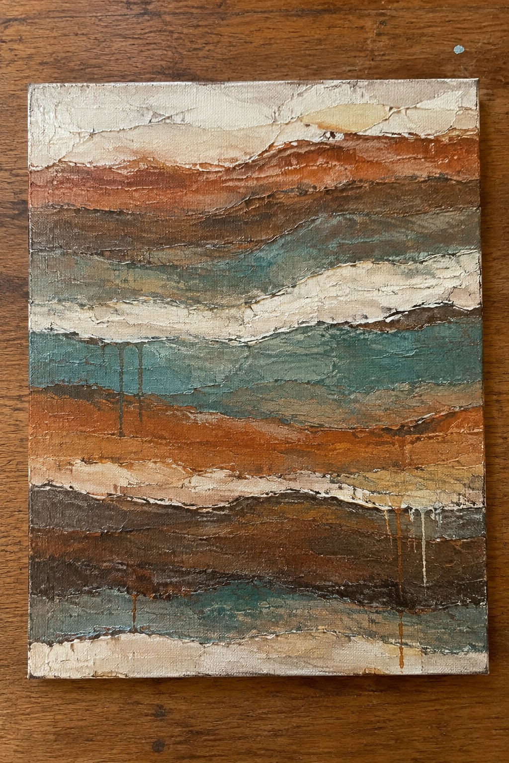 Abstract impasto painting with layered bands of brown, teal, orange and white paint