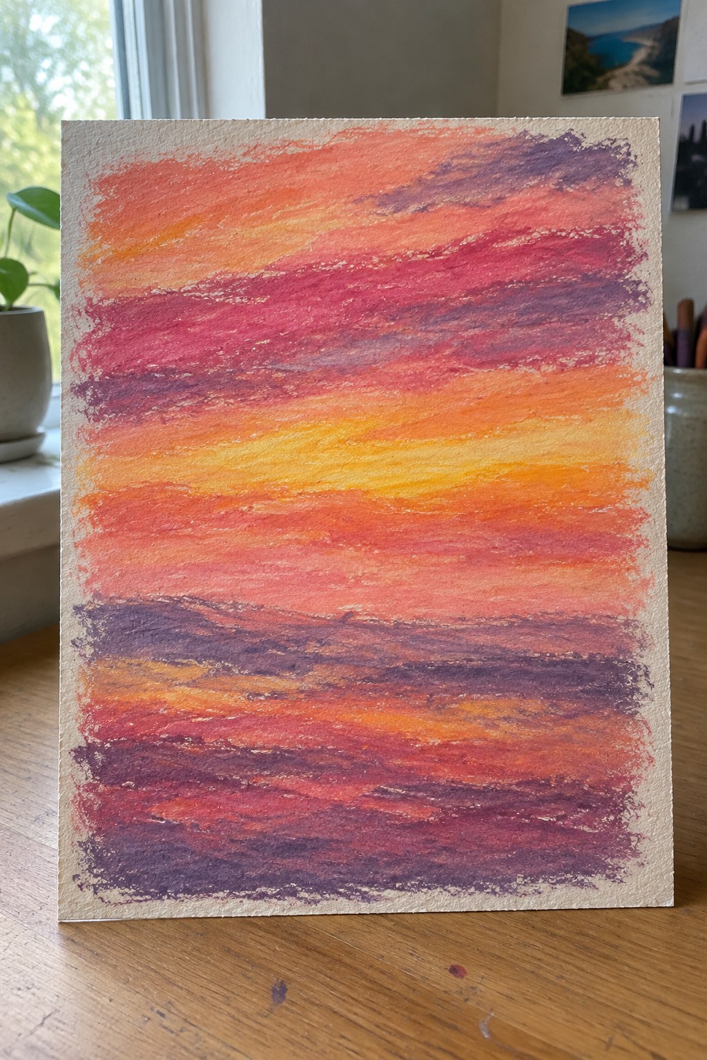 Vibrant sunset painting with horizontal brushstrokes in orange, red, yellow, and purple.