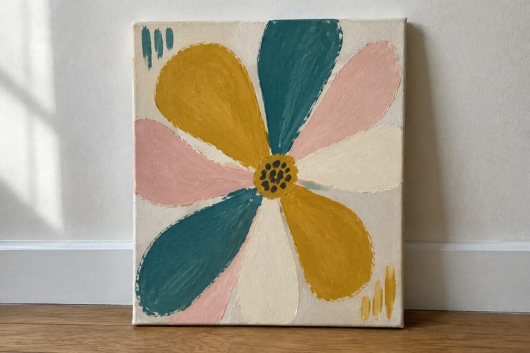 21 Modern Abstract Floral Canvas Art Featuring Simplified Petal Shapes Abstract flower painting with yellow, teal, pink petals and dotted center on canvas