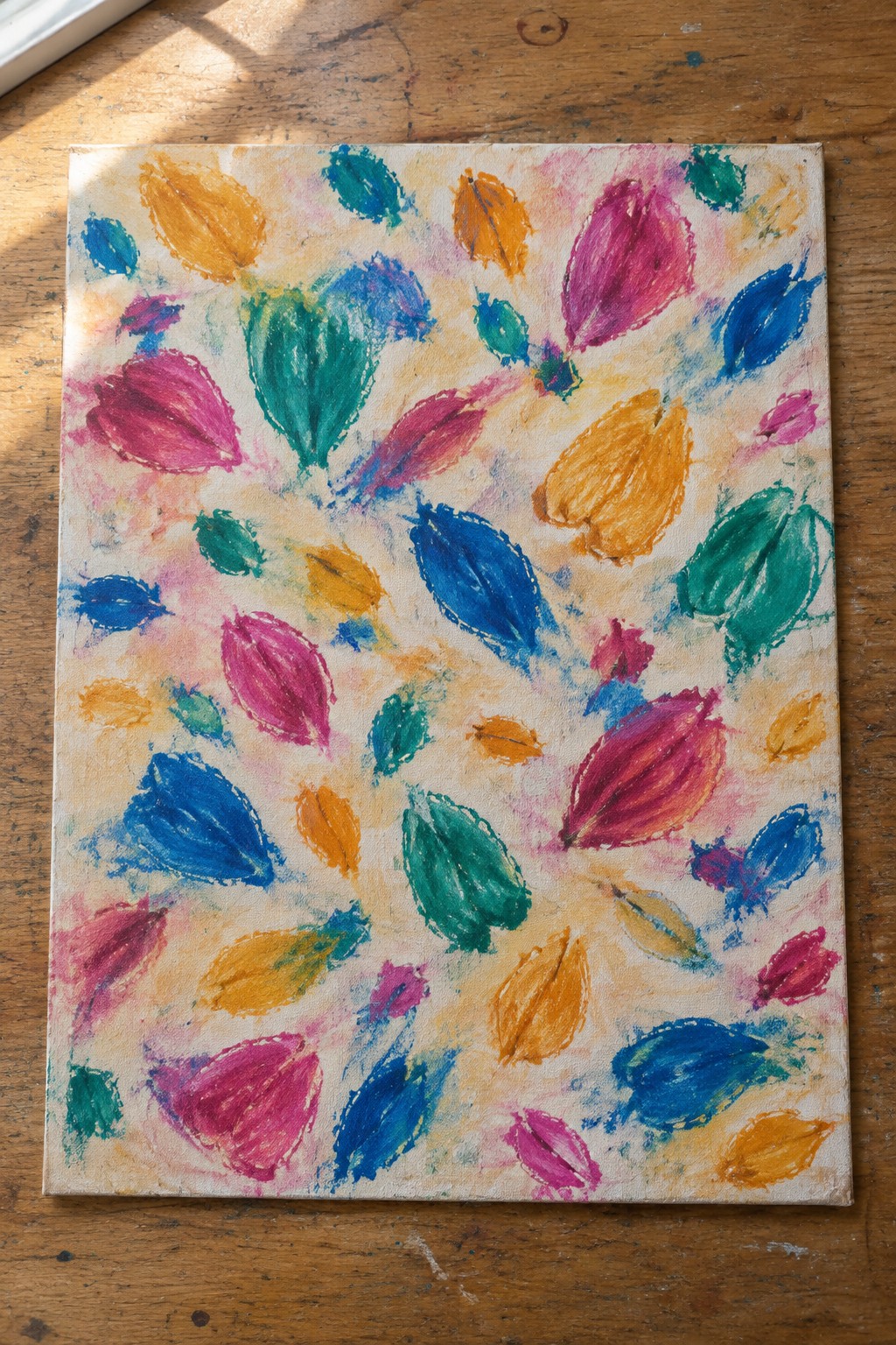 Vibrant abstract canvas with scattered colorful leaf shapes in pink, blue, yellow, green