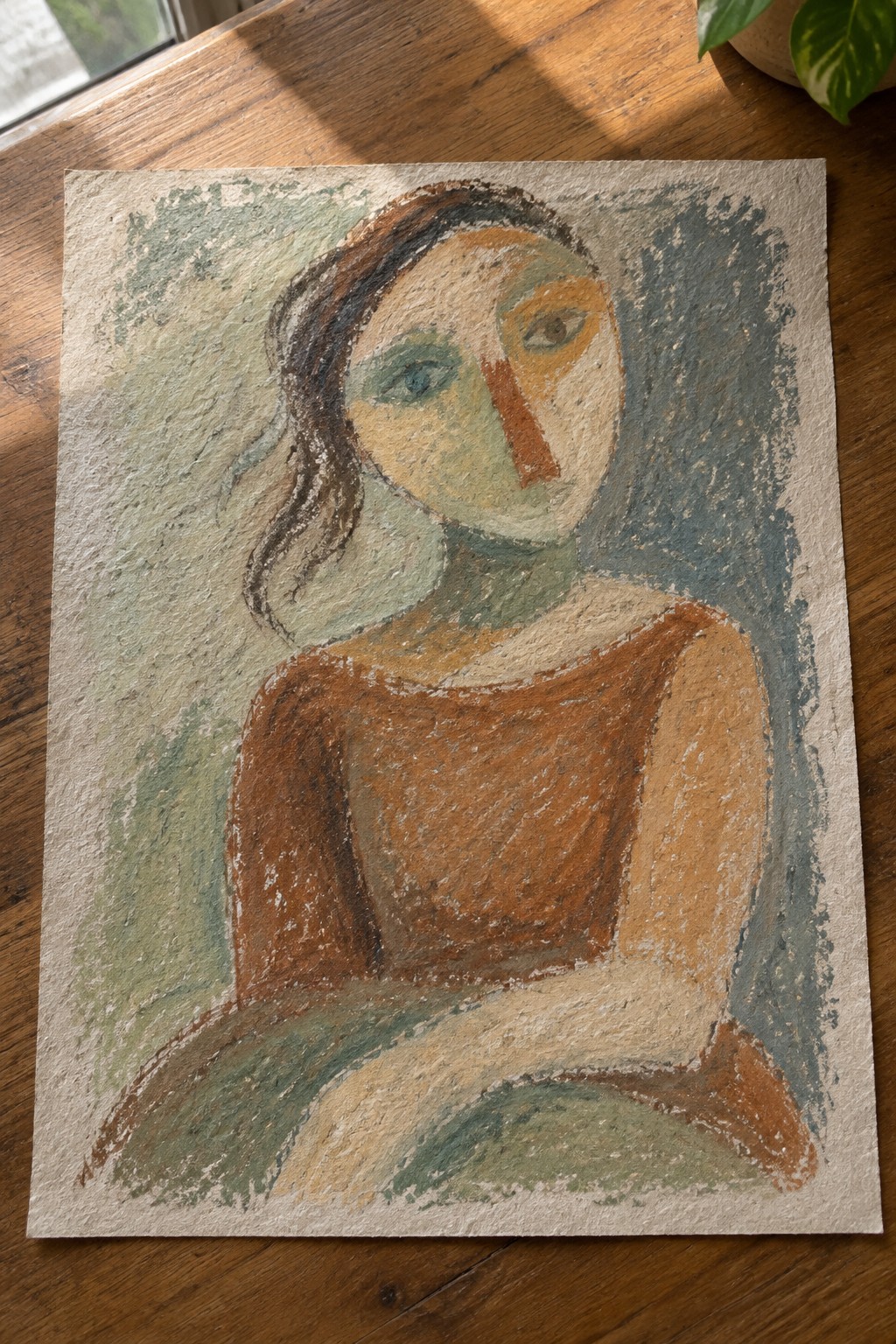 Abstract pastel portrait of woman in brown top on sunlit wooden table