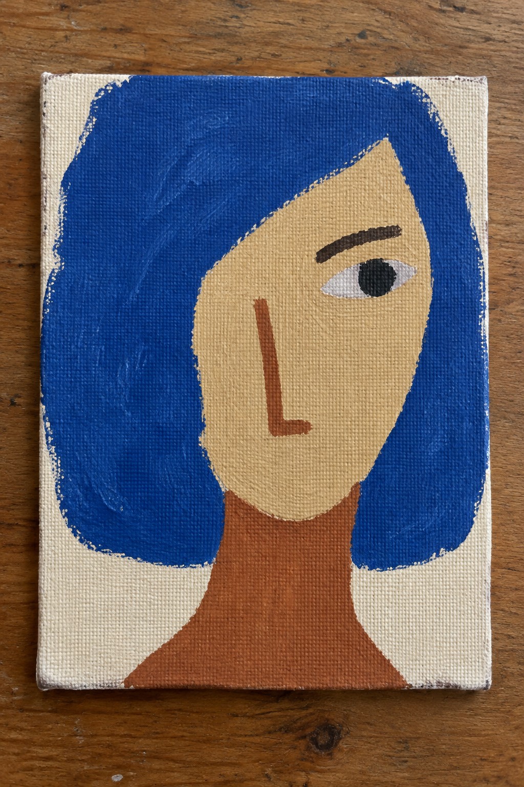 Stylized canvas portrait of a face with blue bobbed hair and brown neck