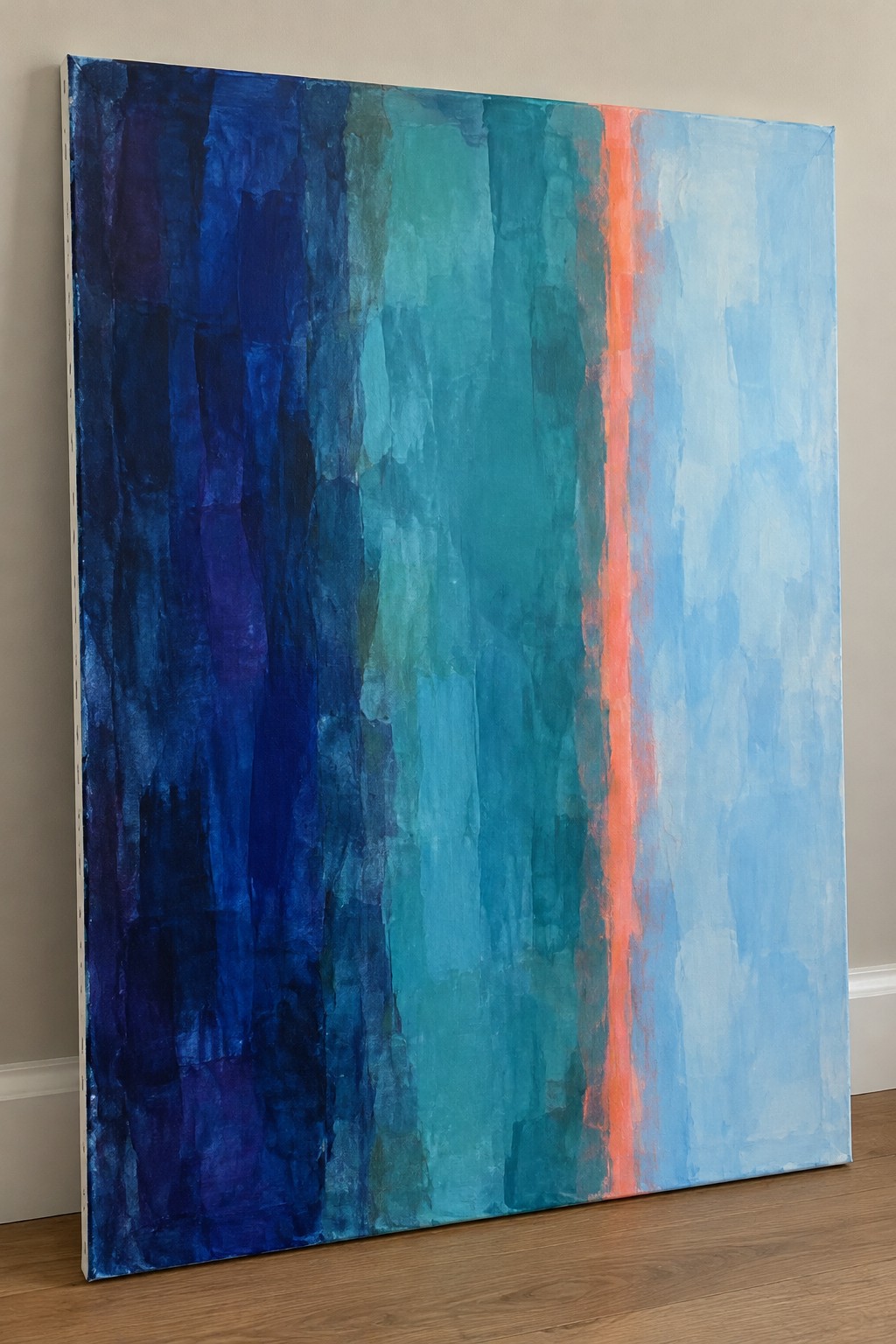 Abstract painting with vertical blue teal brushstrokes and bright orange stripe on wooden floor