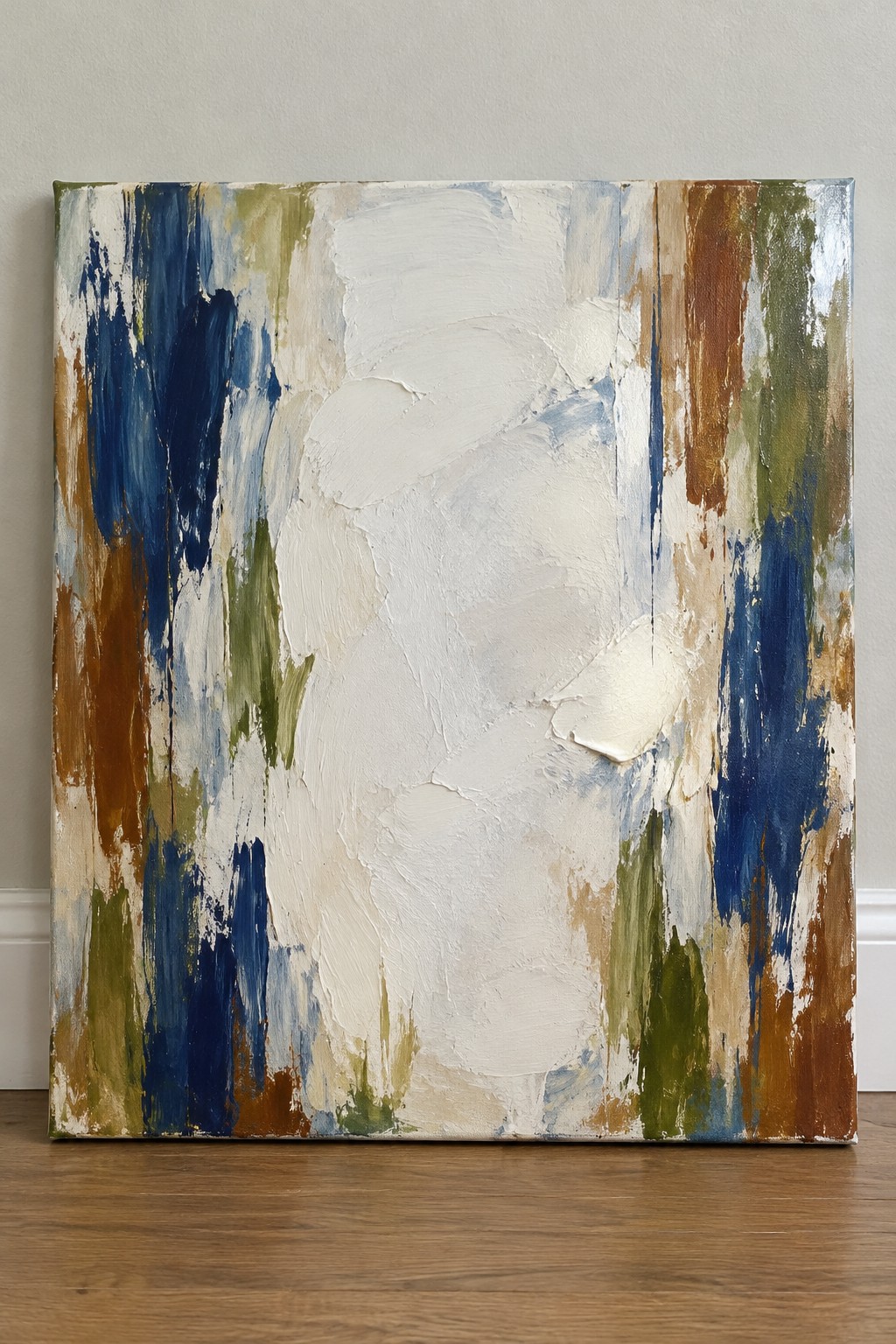 Abstract painting with thick textured strokes in white, blue, brown, and green