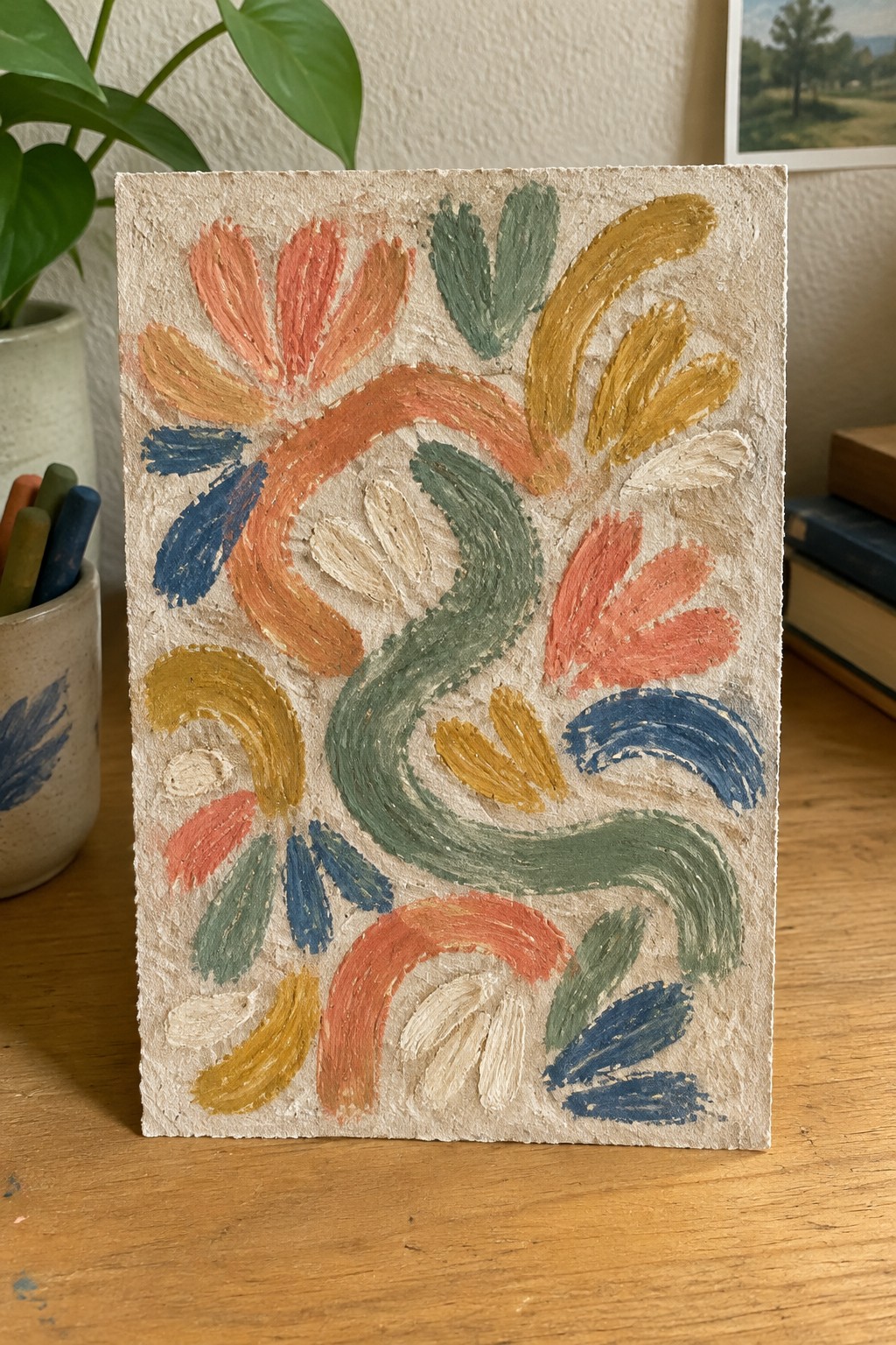 Abstract painting with coral, green, yellow, and blue floral swirls on textured beige paper