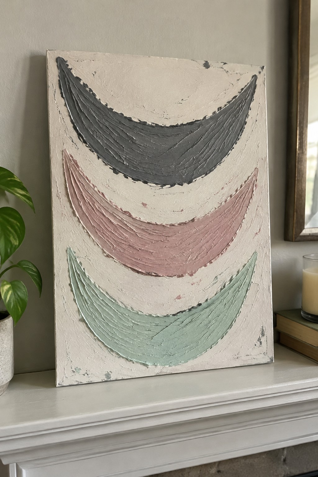 Textured abstract painting with gray, pink, and mint green arched forms on off-white canvas.