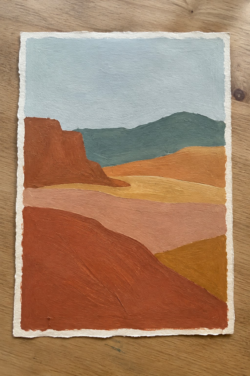 Abstract landscape painting with layered hills in red, orange, teal, and blue tones.