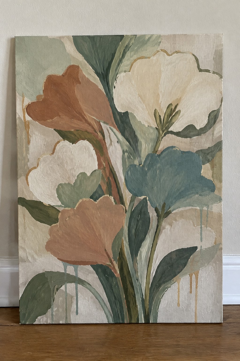 Abstract painting of oversized flowers in cream, rust, teal, and green with drips